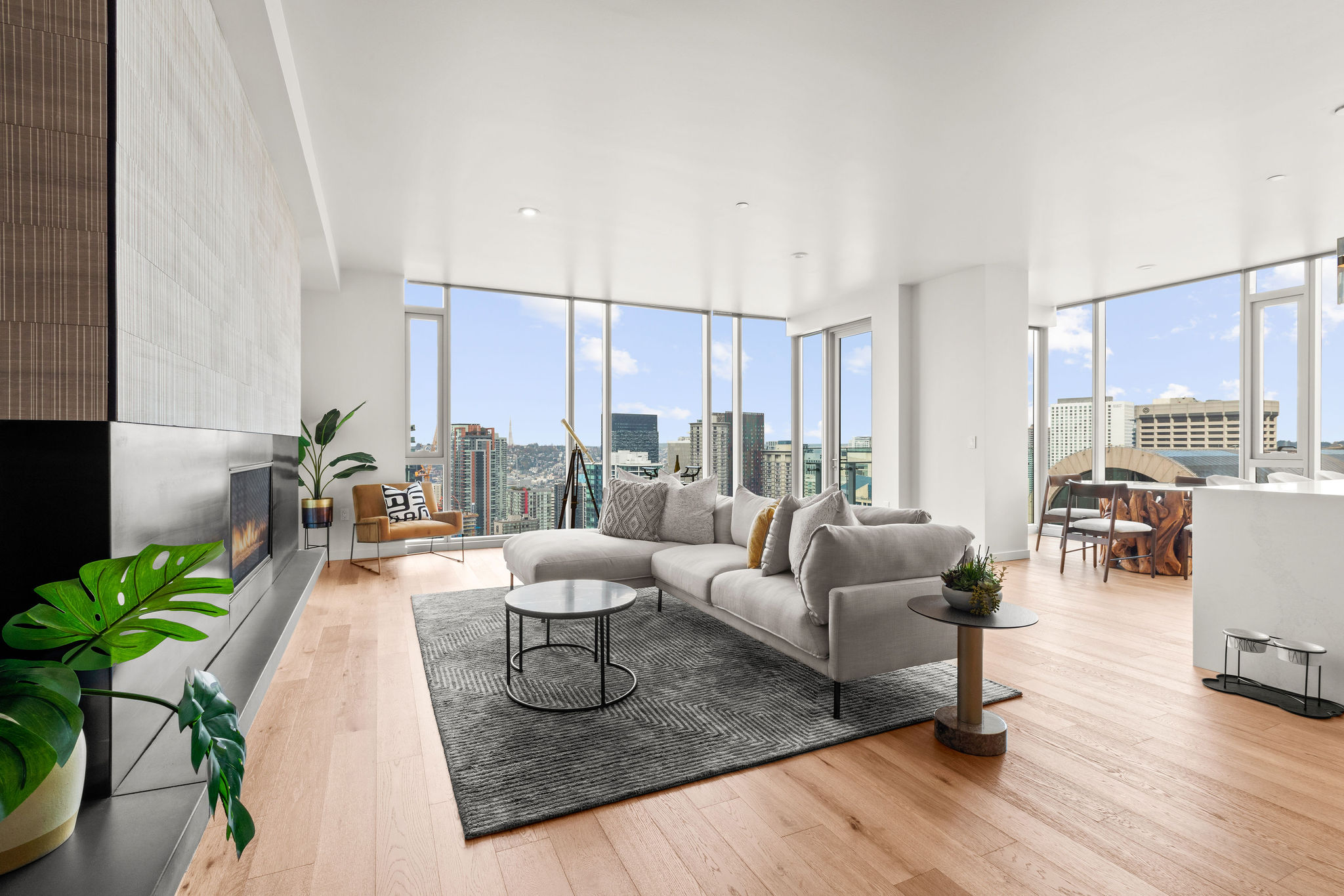 Penthouse Living Room living room and kitchen with couch and table