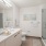 Downtown Seattle Luxury Apartments - Bathroom Designed With Spa-Quality Features, Walk-In Showers With Floating Beach, Textured Cabinetry, Large Vanity, And Luxurious Hard Surface Flooring.