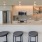 studio kitchen with ample counter space and lighting