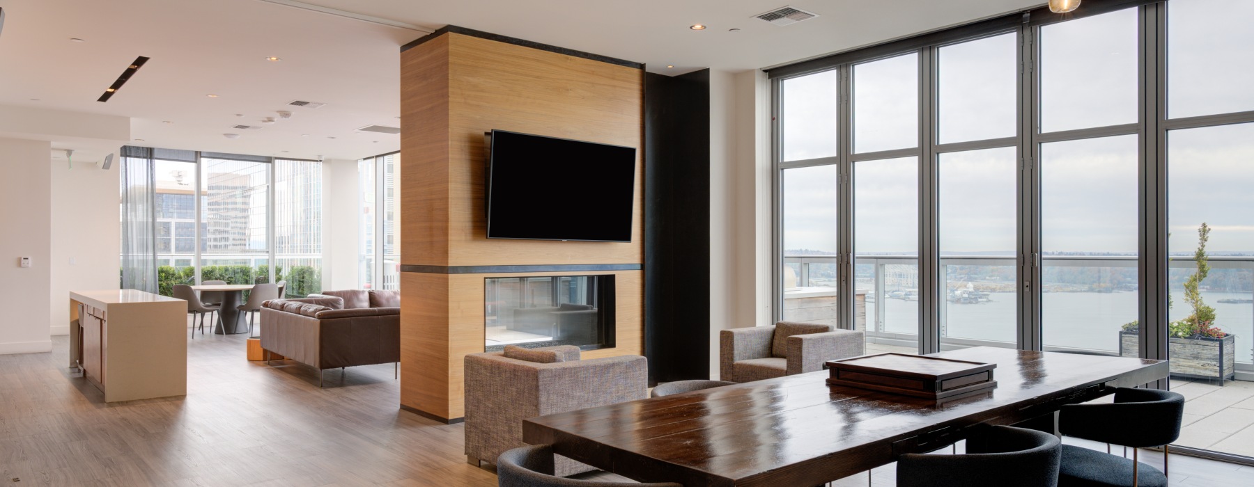 large room with fireplace and table with chairs