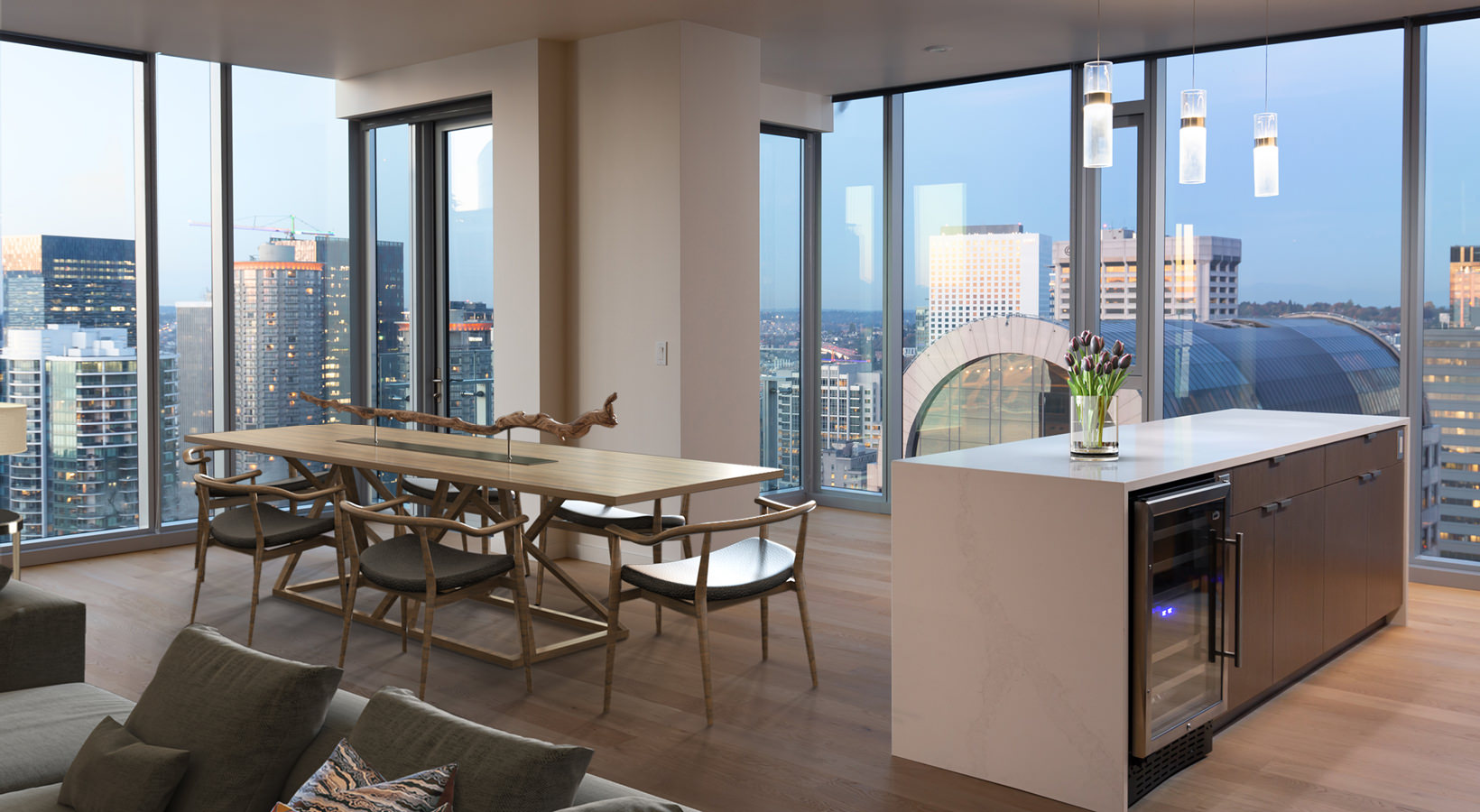 open dining area with city views and private balcony access
